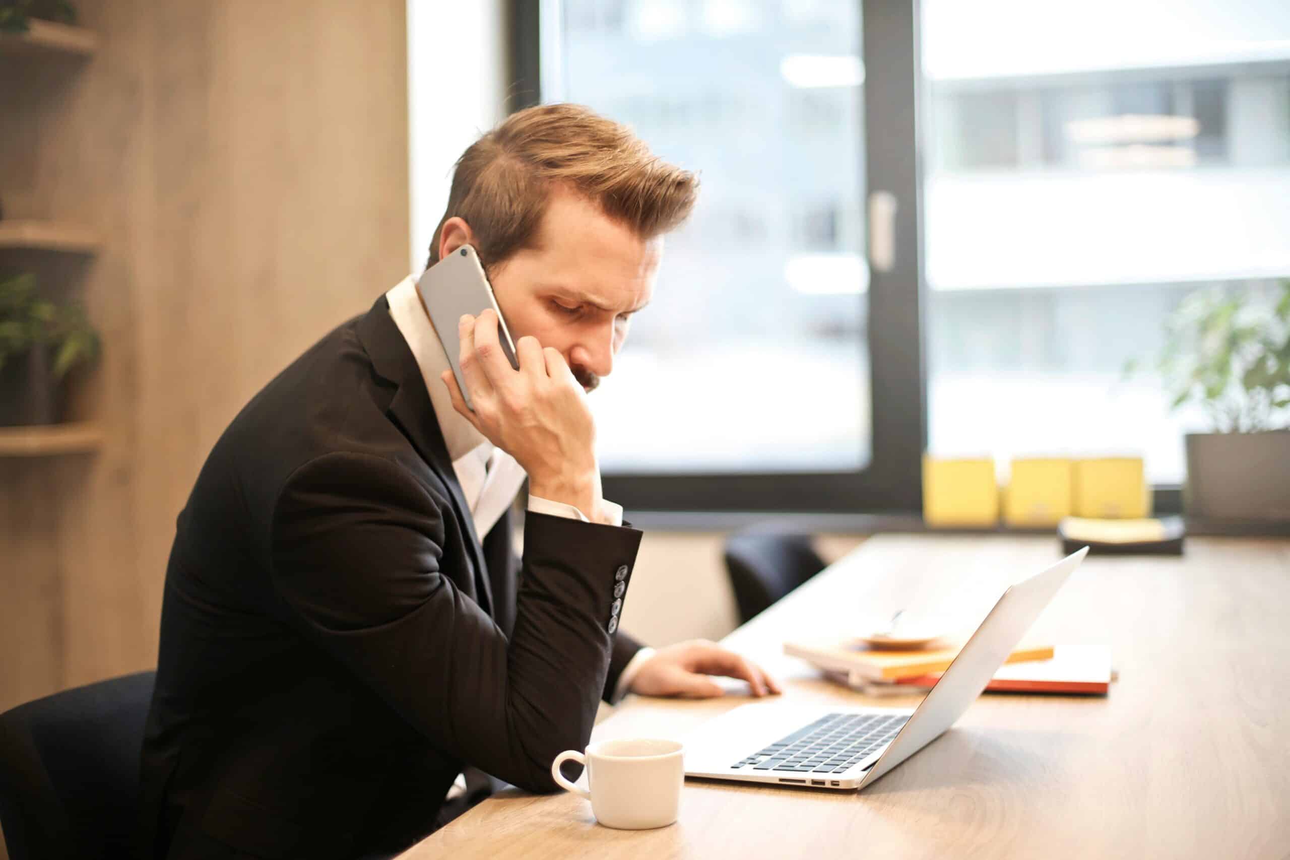 Person sitting at desk working representing what constitutes insubordination in the workplace