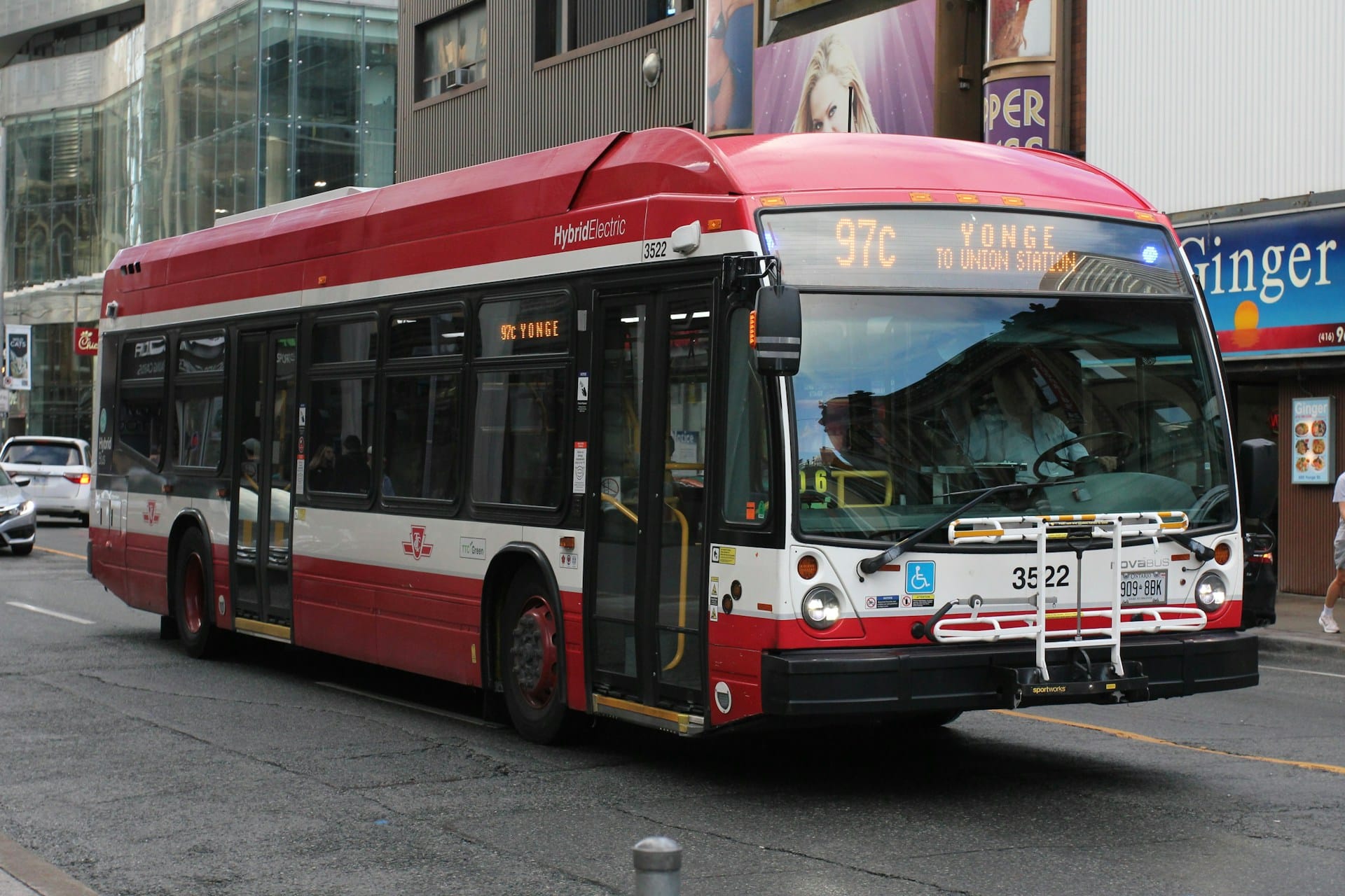 A red, black and white Toronto Transit Commission (TTC) city bus, representing drug and alcohol testing requirements for unionized employees